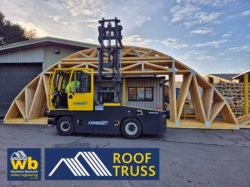 Forklift lifting wooden truss structure