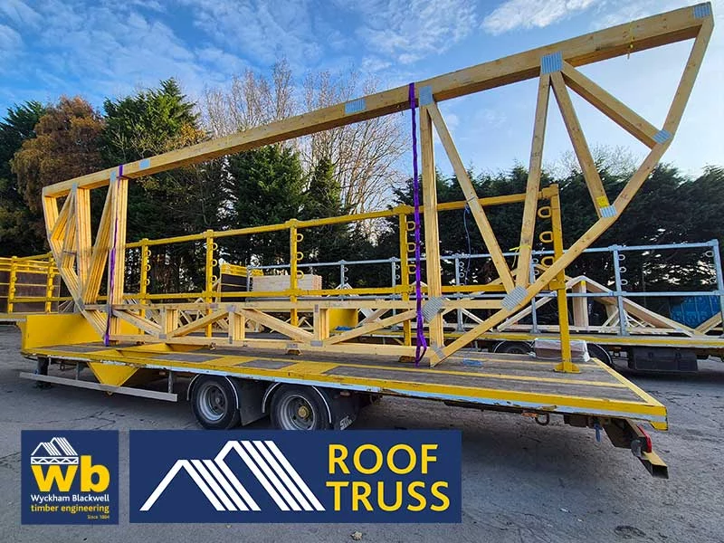 Wooden truss structure on the back of a flatbed lorry