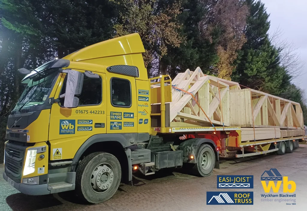 The front of a Wyckham Blackwell lorry with the Trusses loaded on the back.