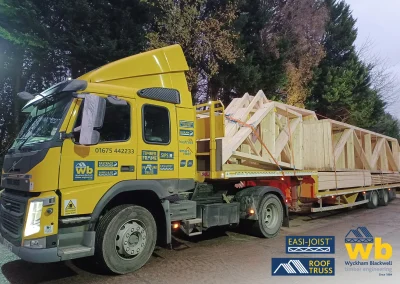 The front of a Wyckham Blackwell lorry with the Trusses loaded on the back.