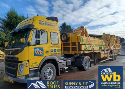 A Wyckham Blackwell branded, articulated flatbed lorry transporting two full loads of roof trusses to a client in Bedford.