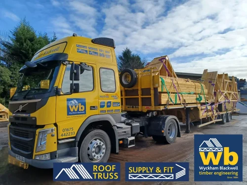 A Wyckham Blackwell branded, articulated flatbed lorry transporting two full loads of roof trusses to a client in Bedford.