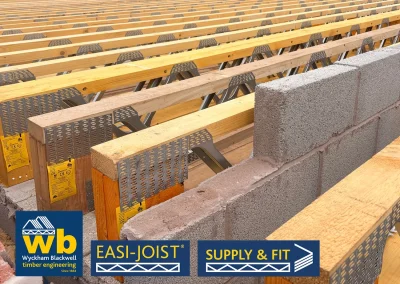 Rows of Easi-Joist Metal Web Joists around a breeze block wall.