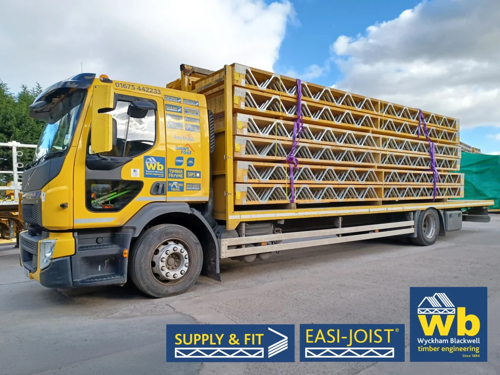 A yellow Wyckham Blackwell branded lorry with a full load of easi-joist metal web joists