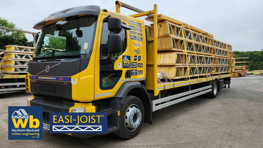 Yellow Wyckham Blackwell lorry with Easi-Rafter strapped on the back