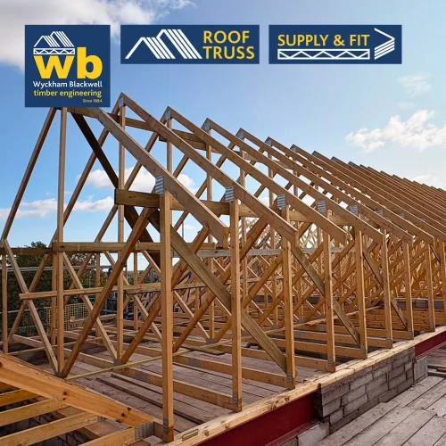 Rows of timber Roof Trusses on a building frame under a blue sky, with Wyckham Blackwell logos above.