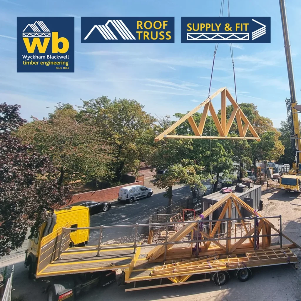 Crane lifts a wooden Roof Truss above a flatbed lorry at a construction site, Wyckham Blackwell logos at top.